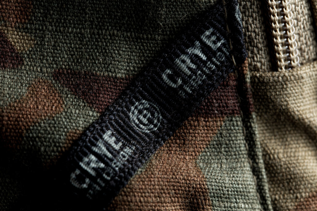Crye Precision combat clothing fabric label on camouflage military uniform