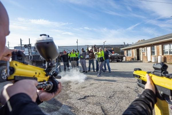 PepperBall less-lethal launcher being fired during a crowd management and public order training exercise.